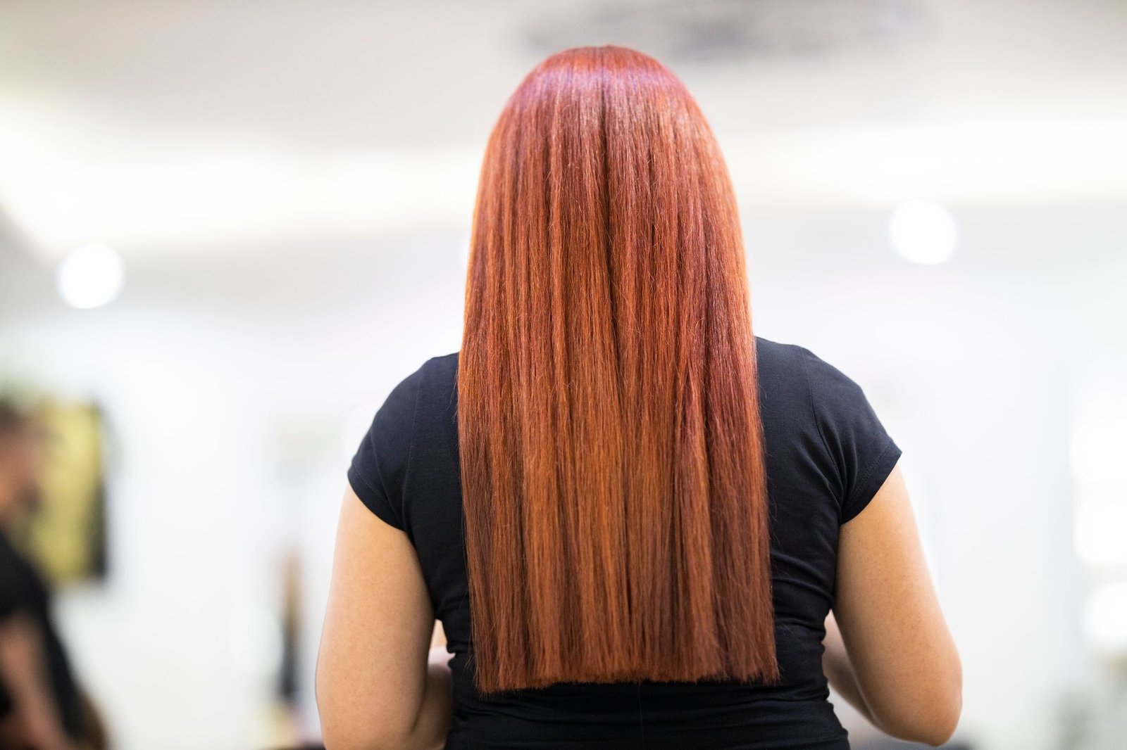 A bride shows off her finished hair color after choosing to dye hair before the wedding.