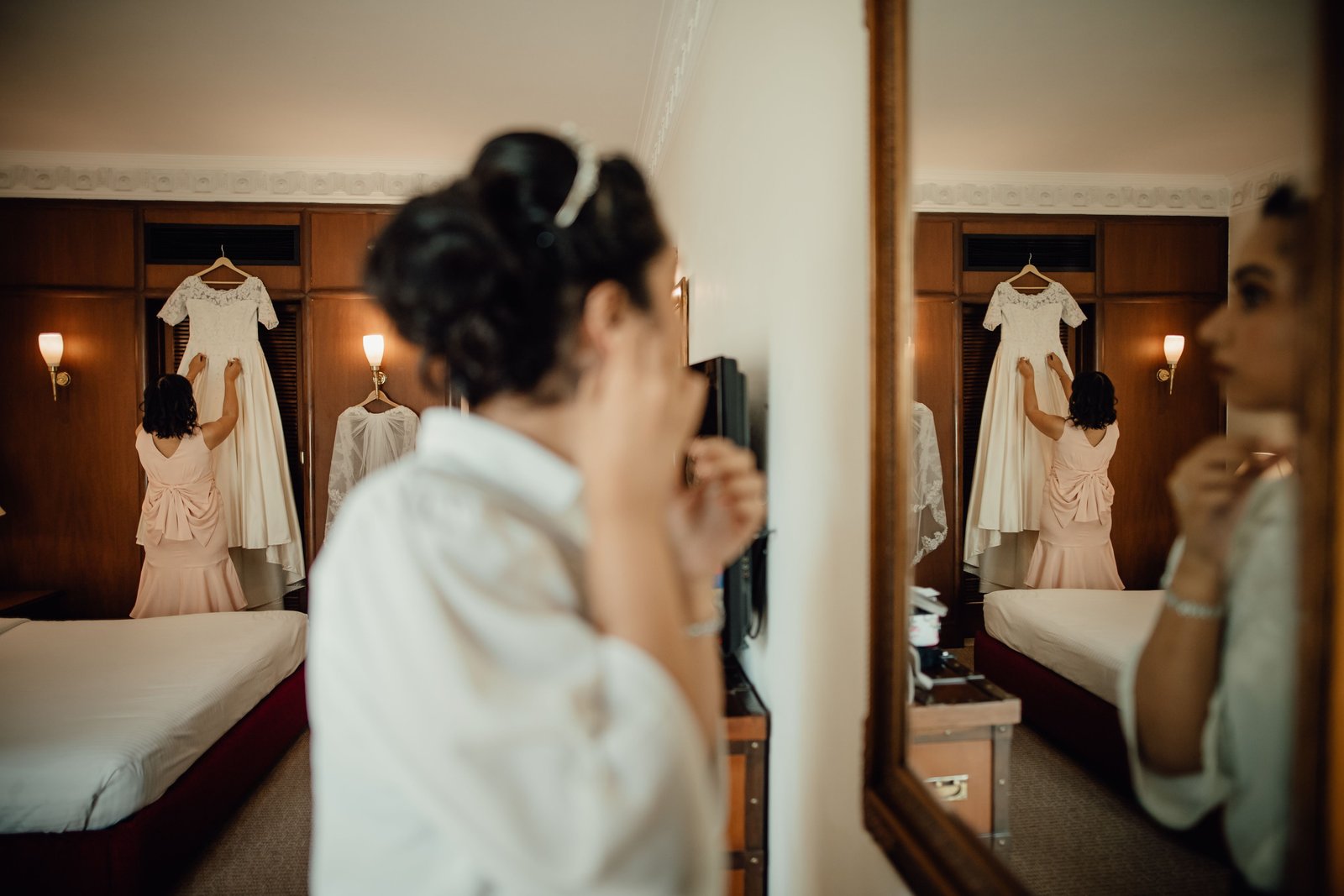 A bride gets ready for her wedding day, a real example of affordable wedding hair and makeup that still looks polished.