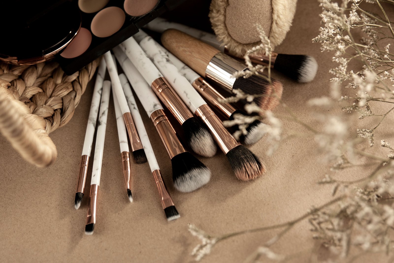 A flat lay of a bridal makeup kit highlights key bridal makeup essentials for the wedding day.