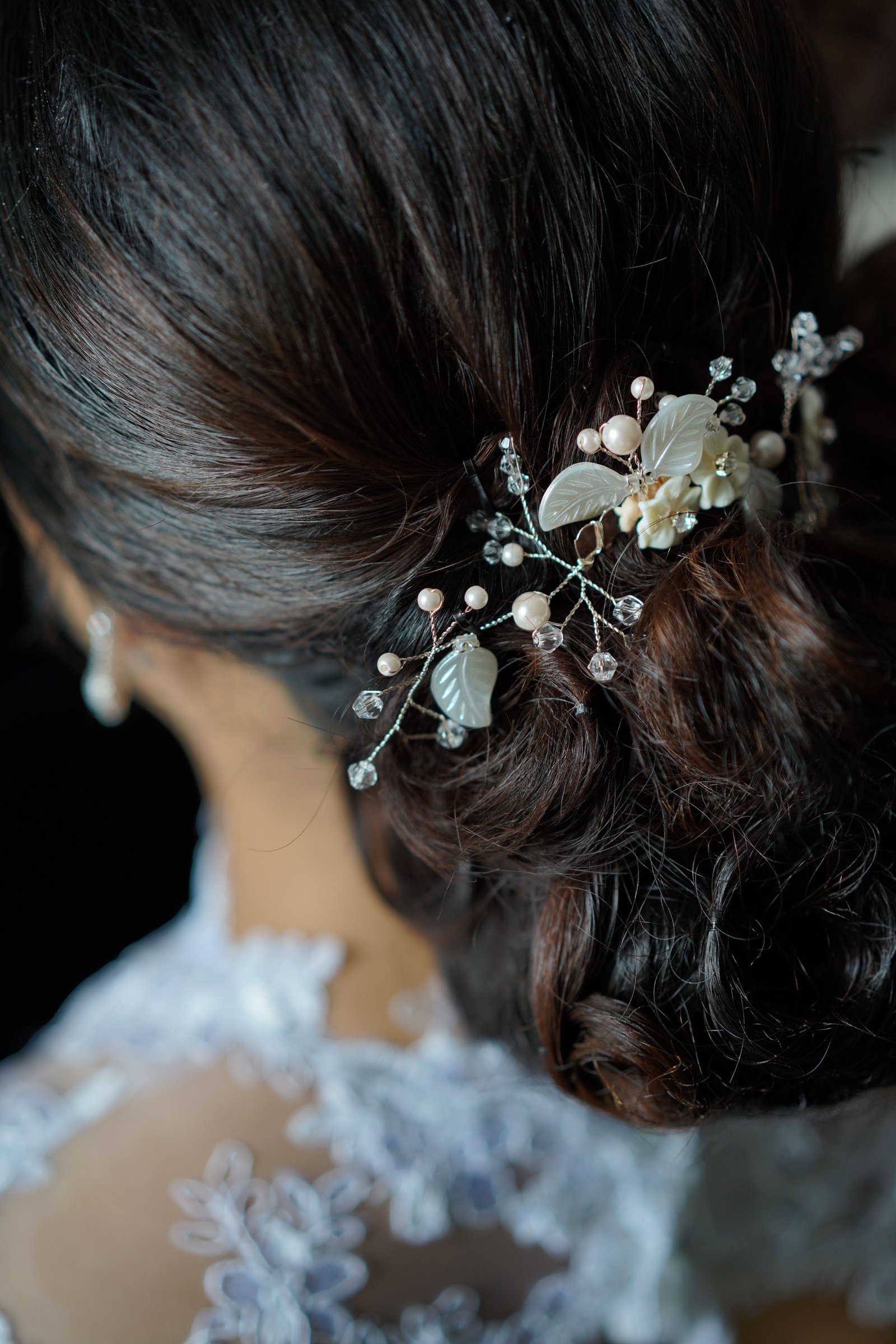 A close-up detail shot of an elegant wedding hairstyle, showing the kind of texture and finish many brides look for.