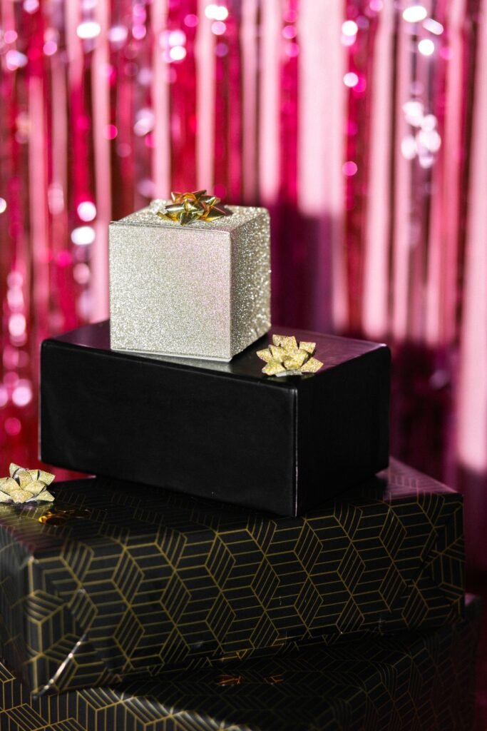 Stacked holiday gift boxes representing festive beauty gifts like the Charlotte Tilbury Advent Calendar 2025