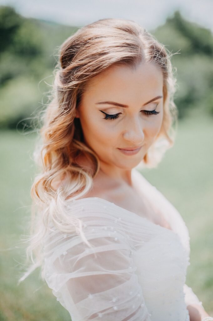 Bride with glowing, hydrated skin set with the best setting spray for dry skin