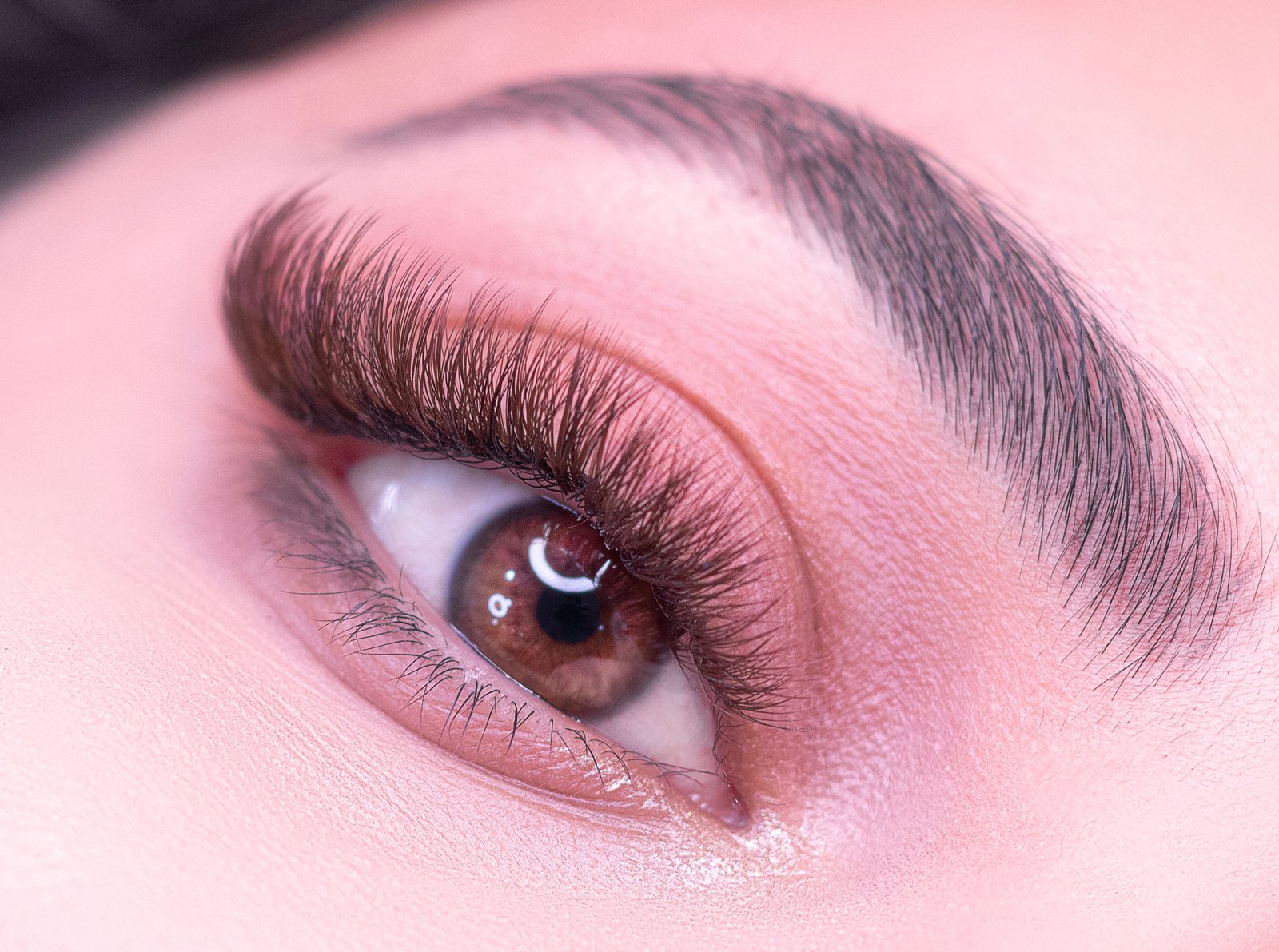 Close-up of a woman's eye highlighting fluffy eyelash extensions