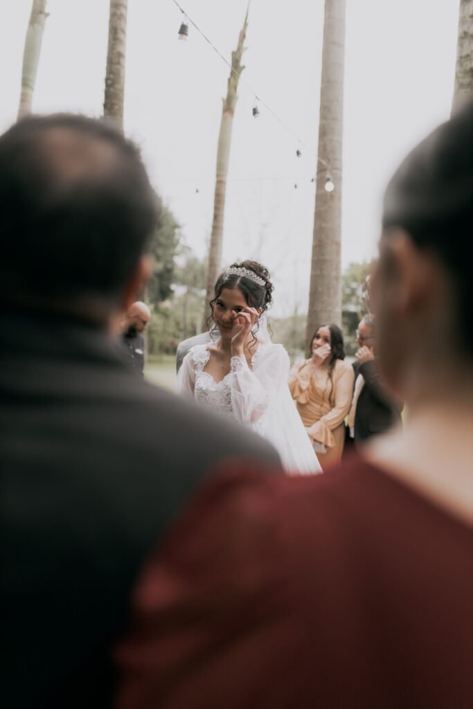 Bride dabbing happy tears, a moment when Lash Paradise Mystic Black washable mascara may smudge