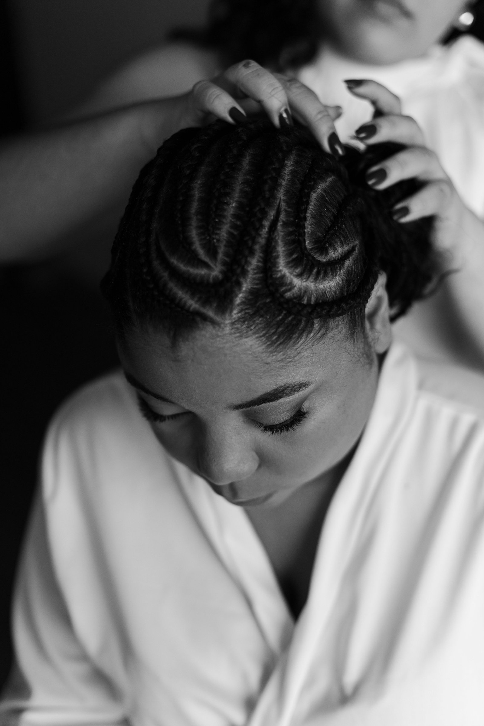 Applying hair cream for black hair to define natural curls