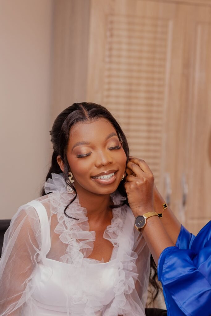 Smiling bride getting ready with soft, wispy lashes like Kiss 11 lashes