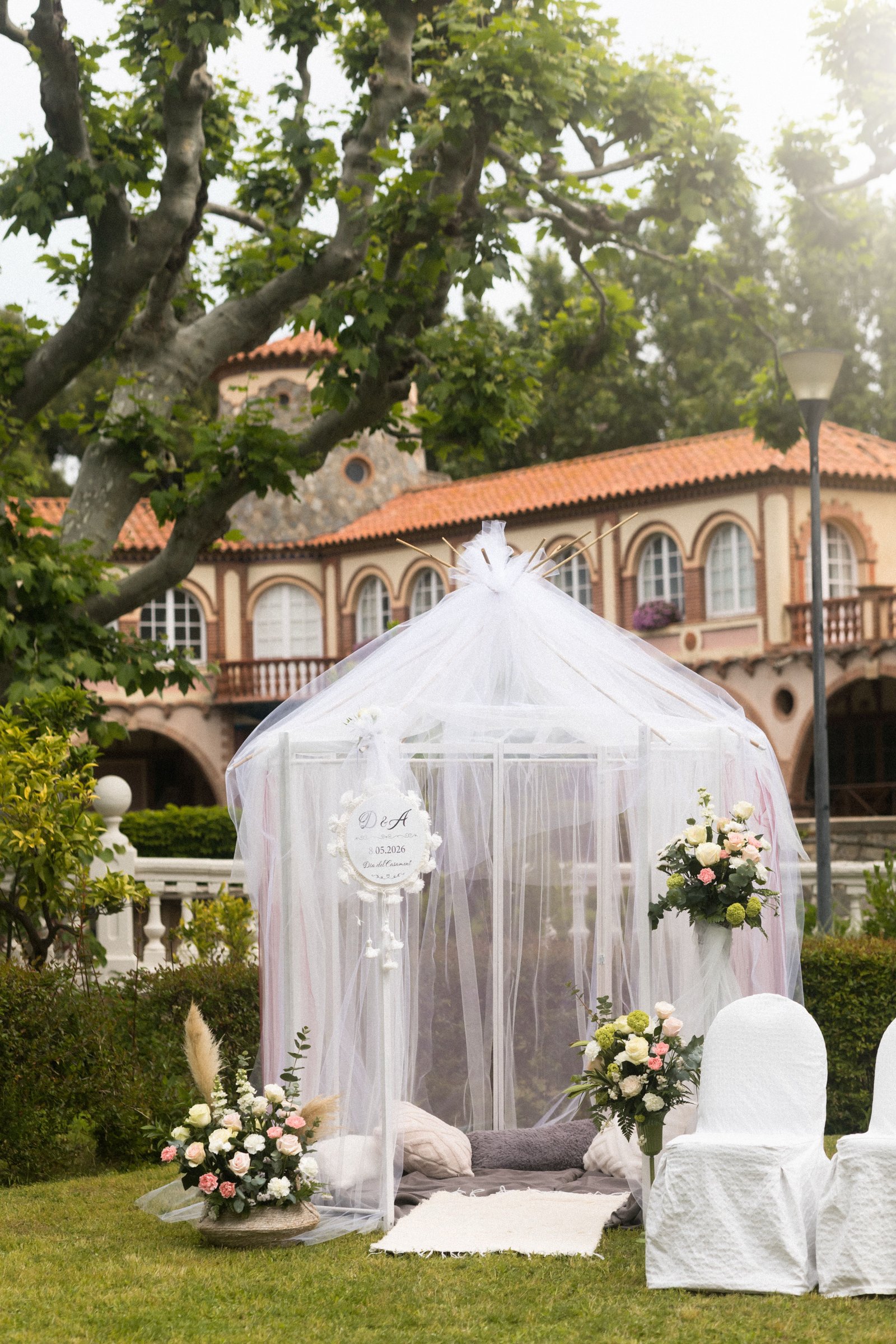 A bride poses in a historic mansion ballroom, reflecting the setting of an Orlo House wedding.