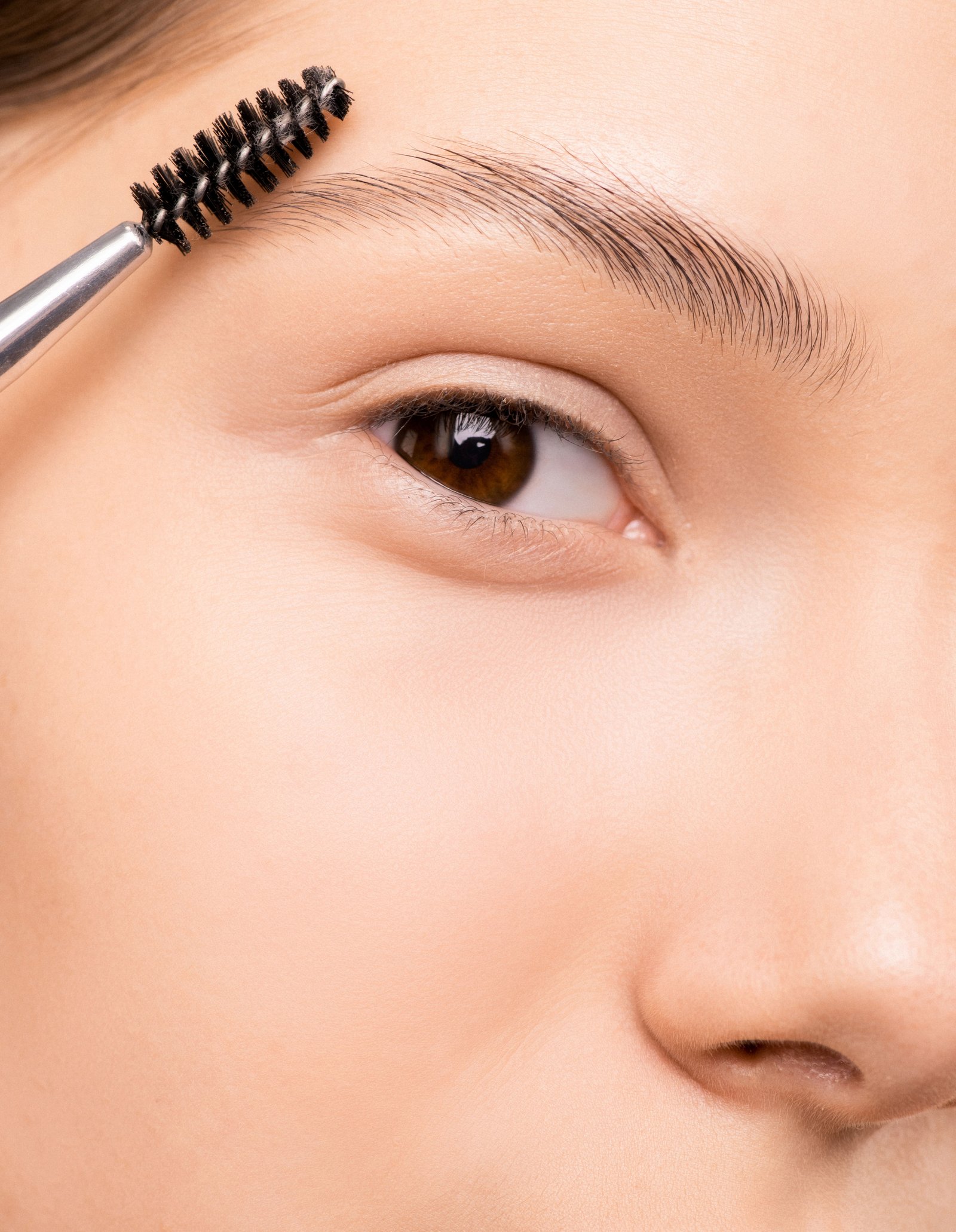 Fake eyebrows filled in with powder and stencil technique