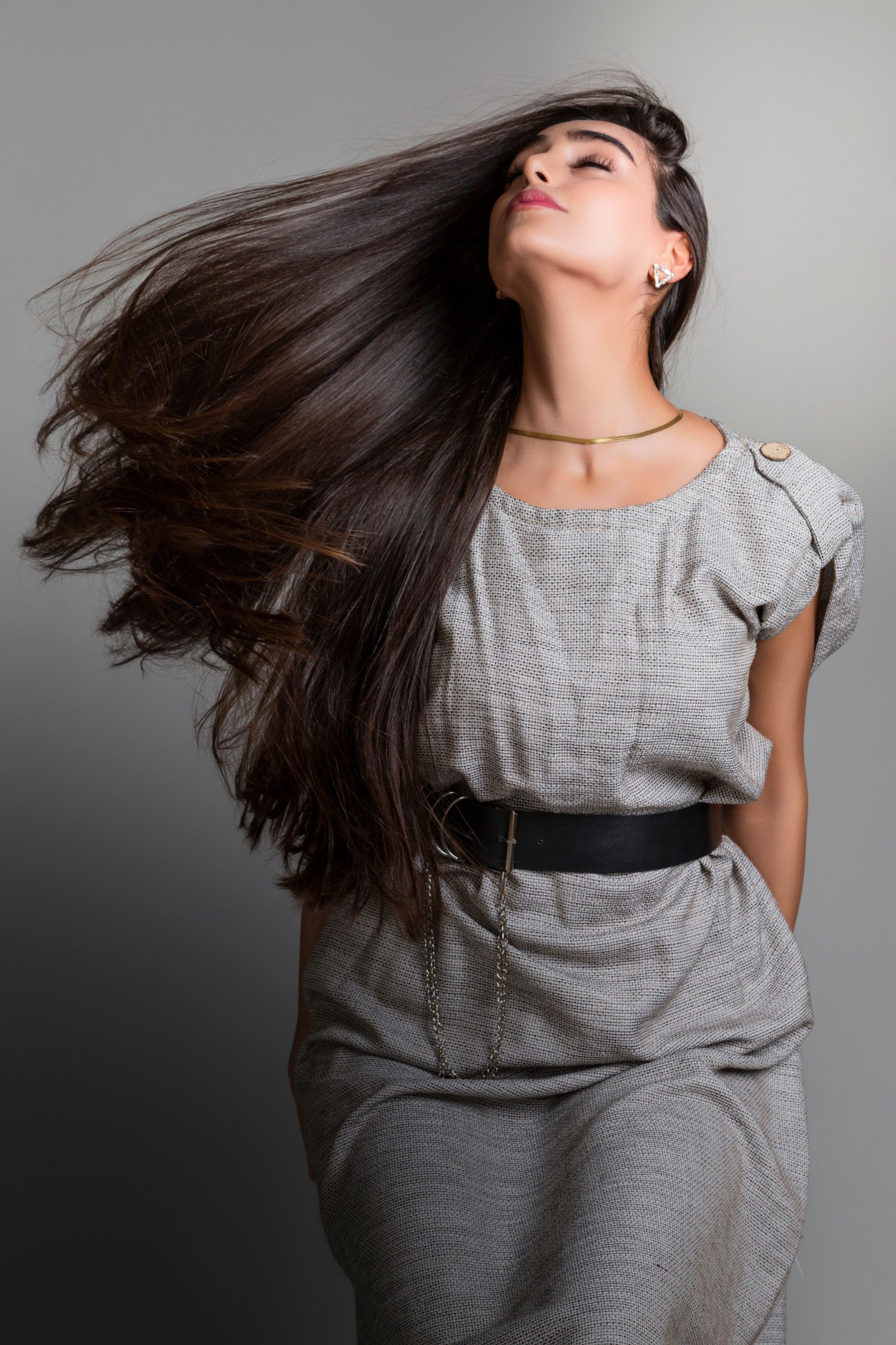 Glossy finished hairstyle achieved with shiny hair products
