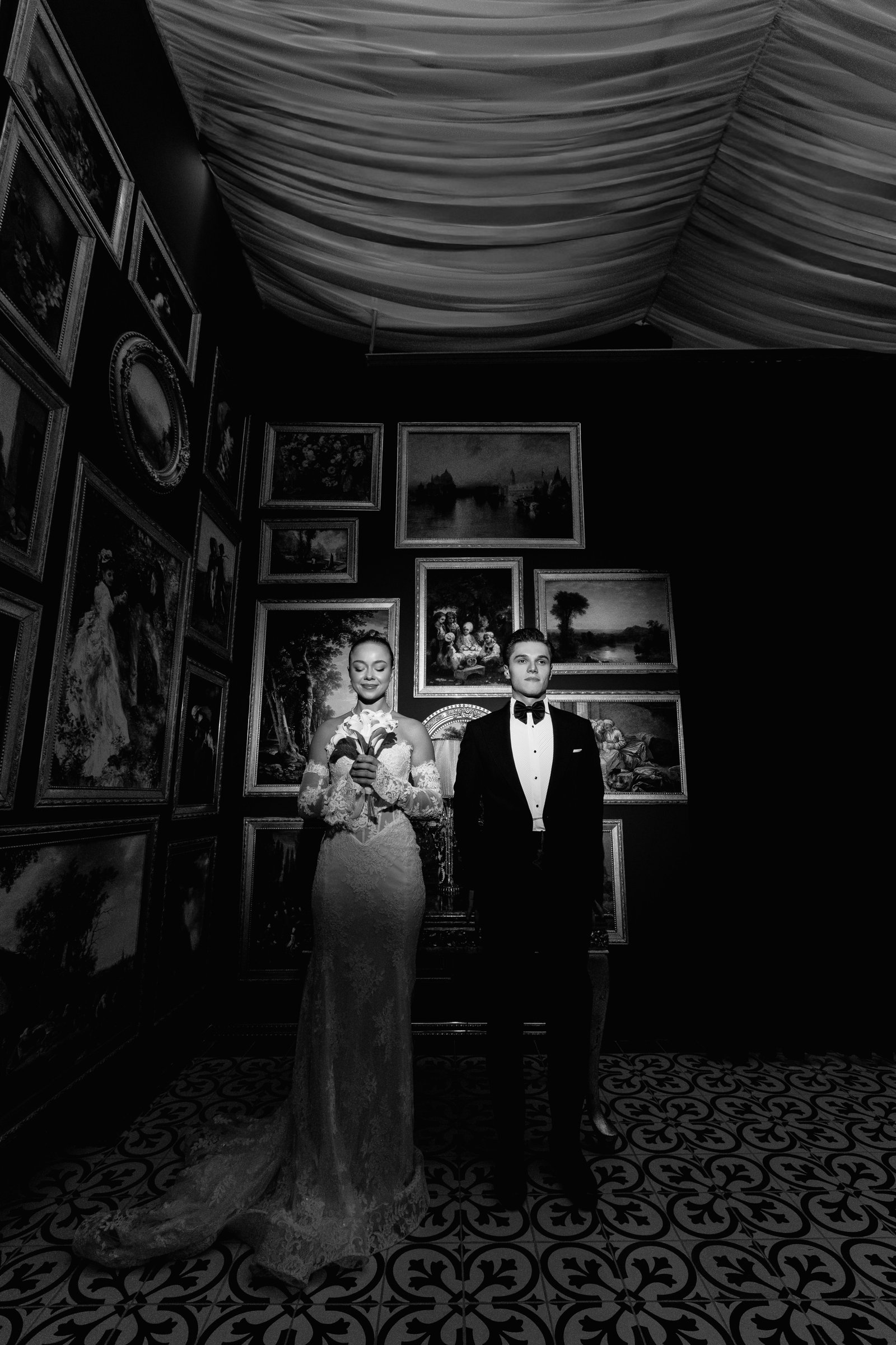 A bride and groom at an art gallery wedding reception venue, illustrating Ringling Museum wedding cost planning.