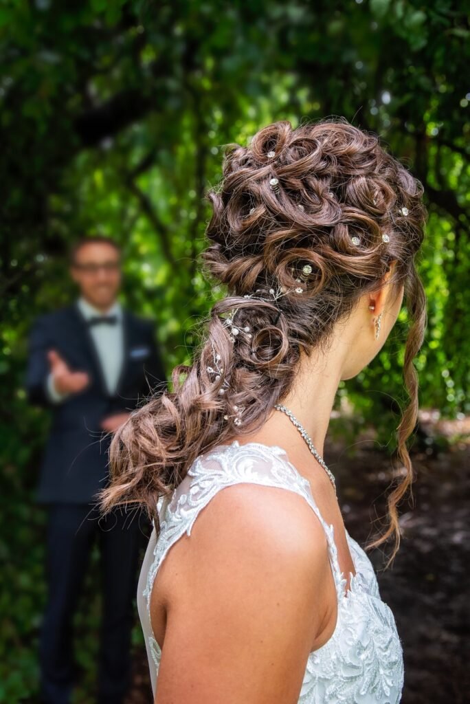 Bride with healthy, glossy curls after a hair bonding treatment routine before the wedding