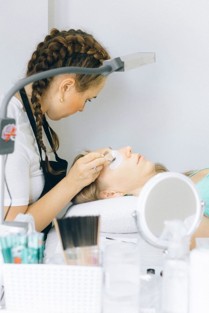 Lash technician working in a clean, organized studio during a lash lounge experience