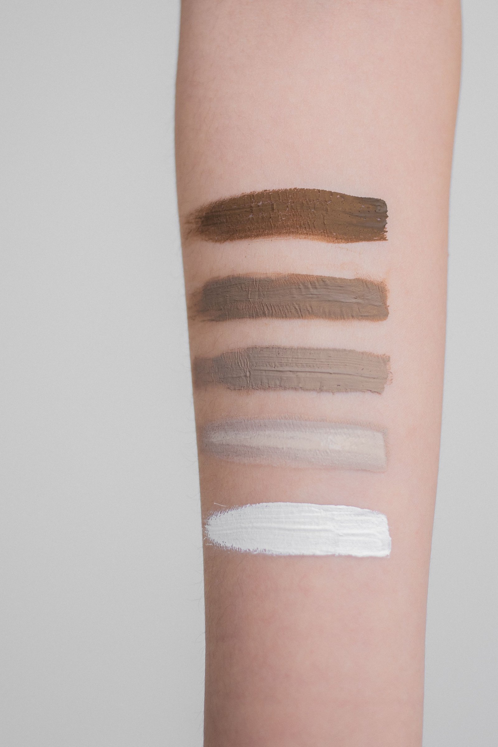 Cream blush and contour palette swatches showing a blended skin-like finish
