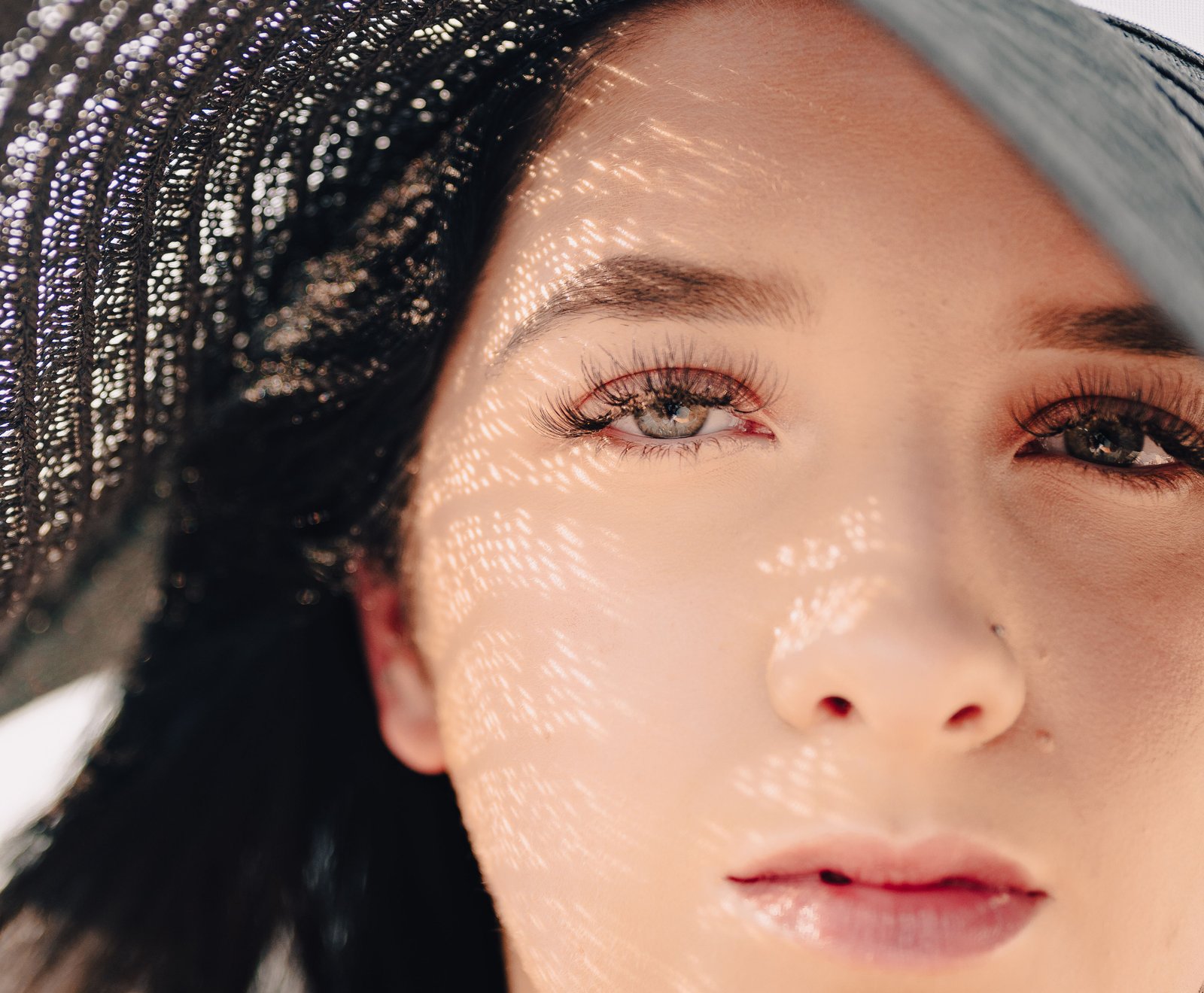 Makeup artist testing warm bronzer tones against different skin undertones
